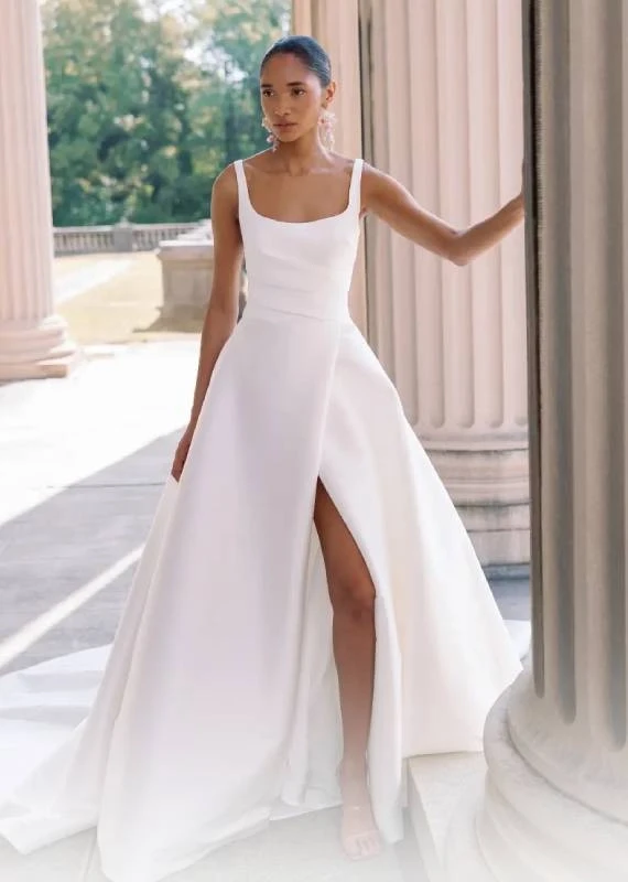 Model wearing a white Sareh Nouri Gown