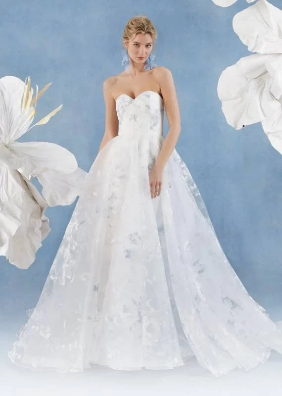 Model wearing a white Savin Prive Gown