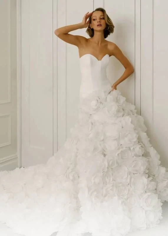 Model wearing a white Savin London Gown