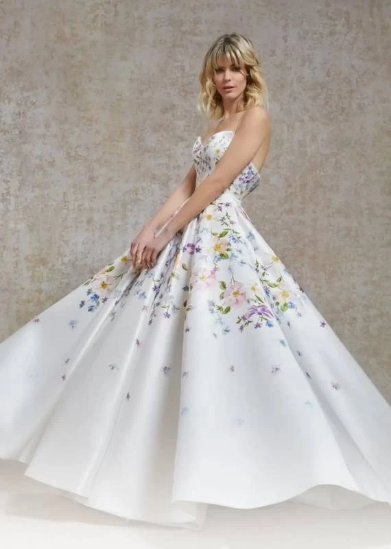 Model wearing a white a Savin London Gown
