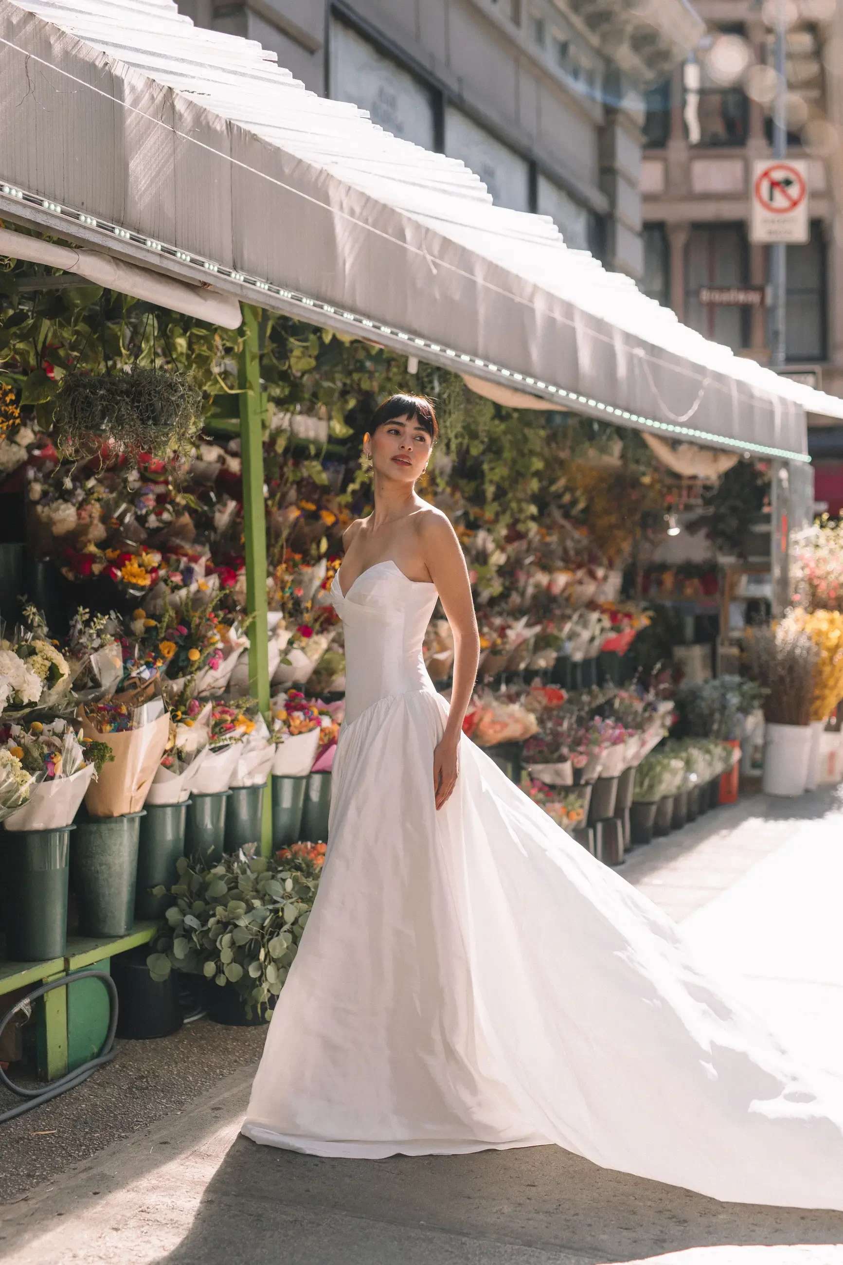 model is wearing a strapless wedding dress