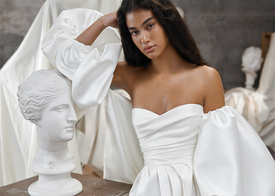 Model wearing a white Gown