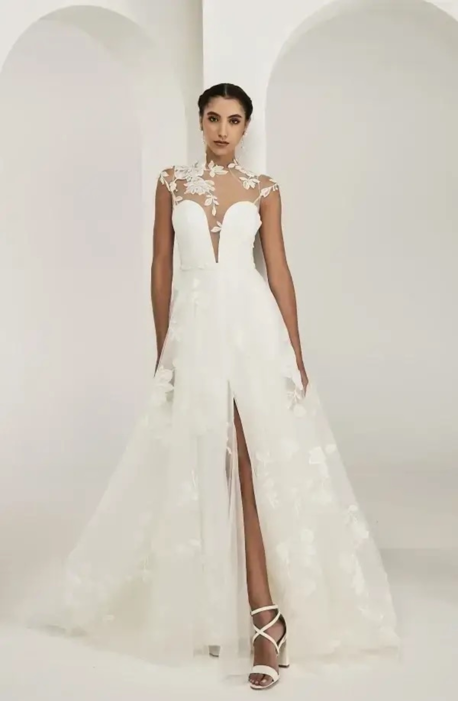 model is wearing an a-line wedding gown