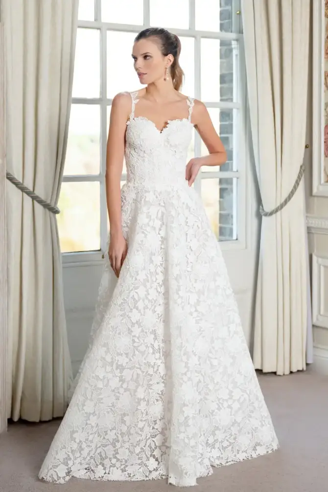 model is wearing a sleeveless a-line bridal gown