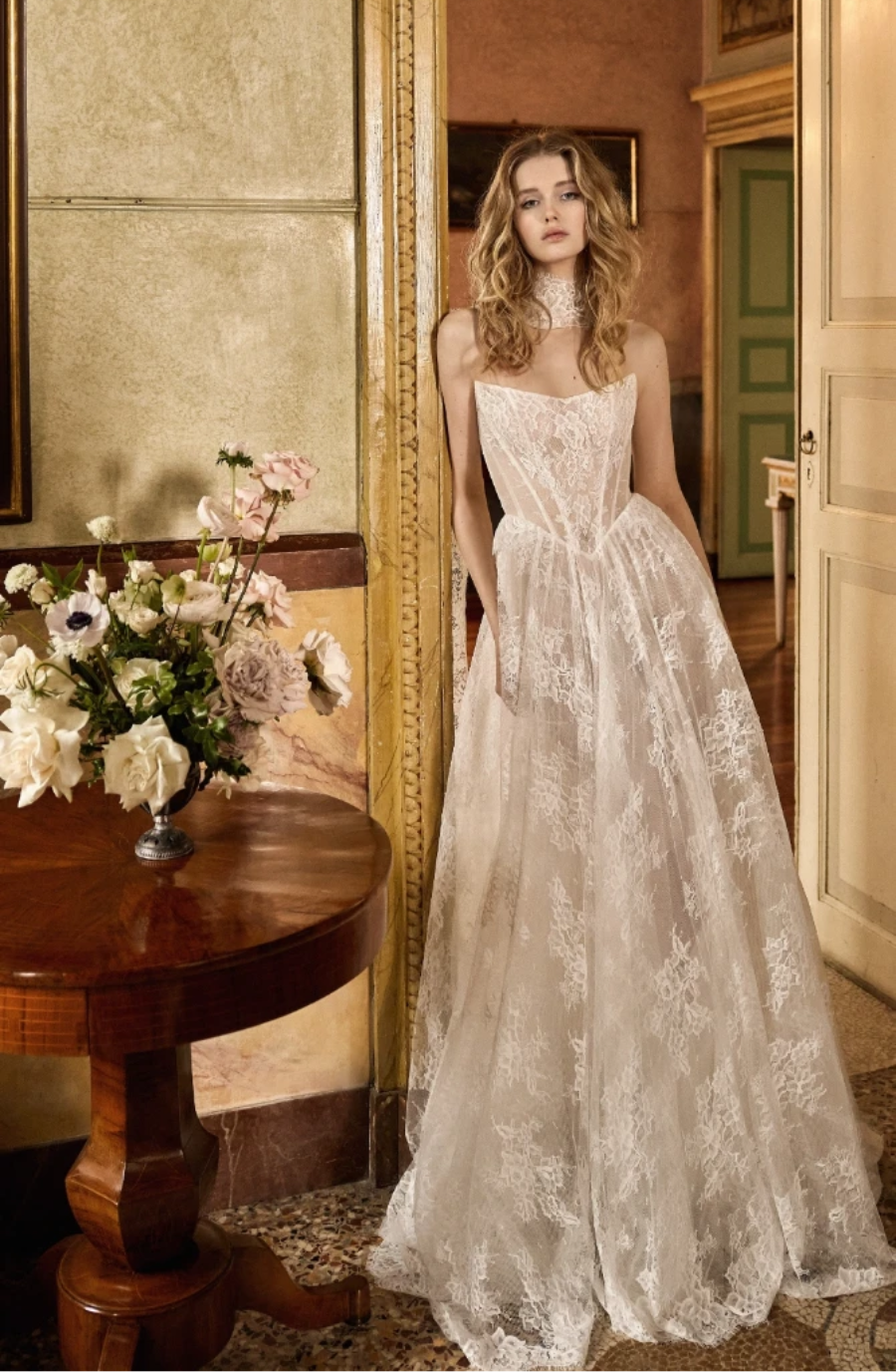 model is wearing a strapless basque wedding dress