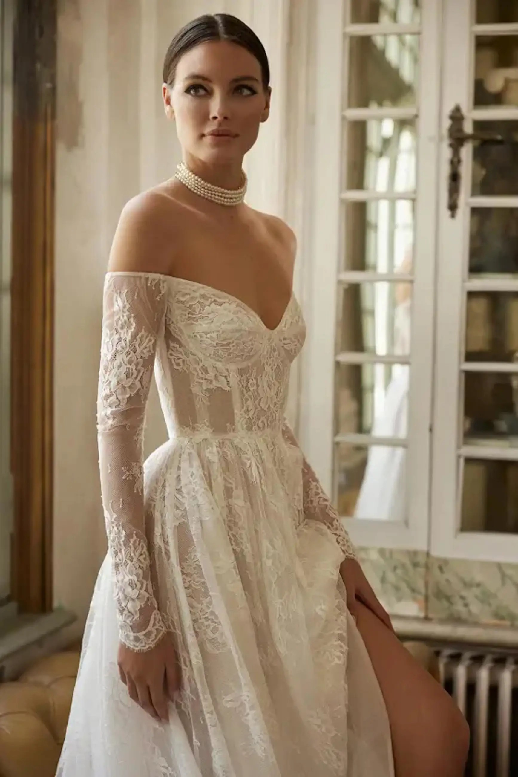 Model wearing a white Anne Barge Gown