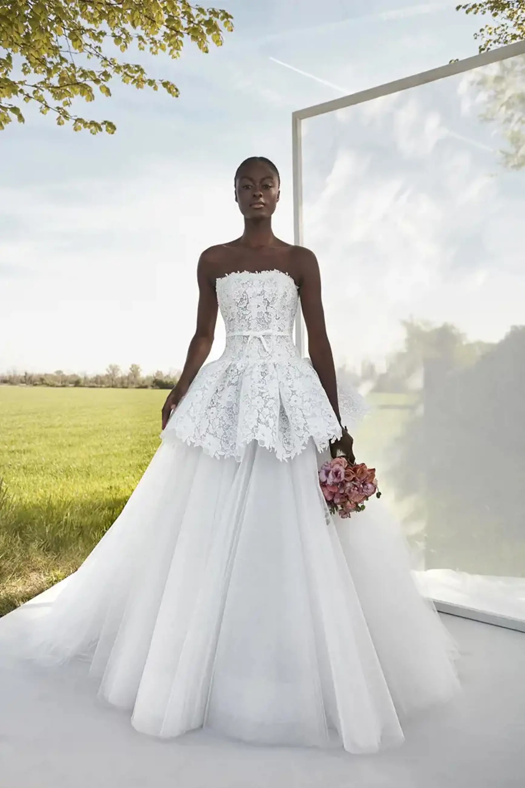 Model wearing a white a JESÚS PEIRÓ Gown