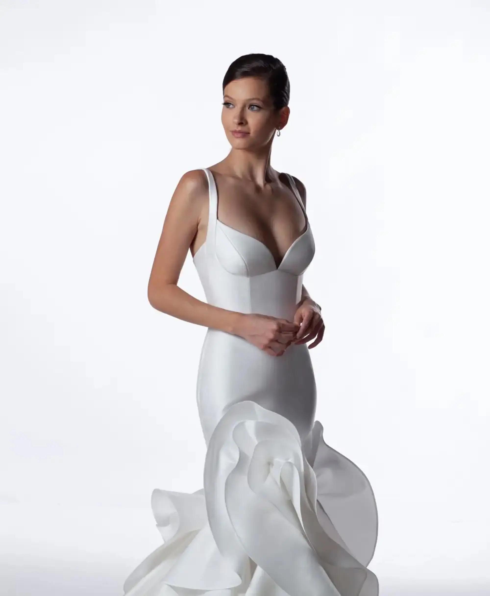 Model wearing a white Anne Barge Gown