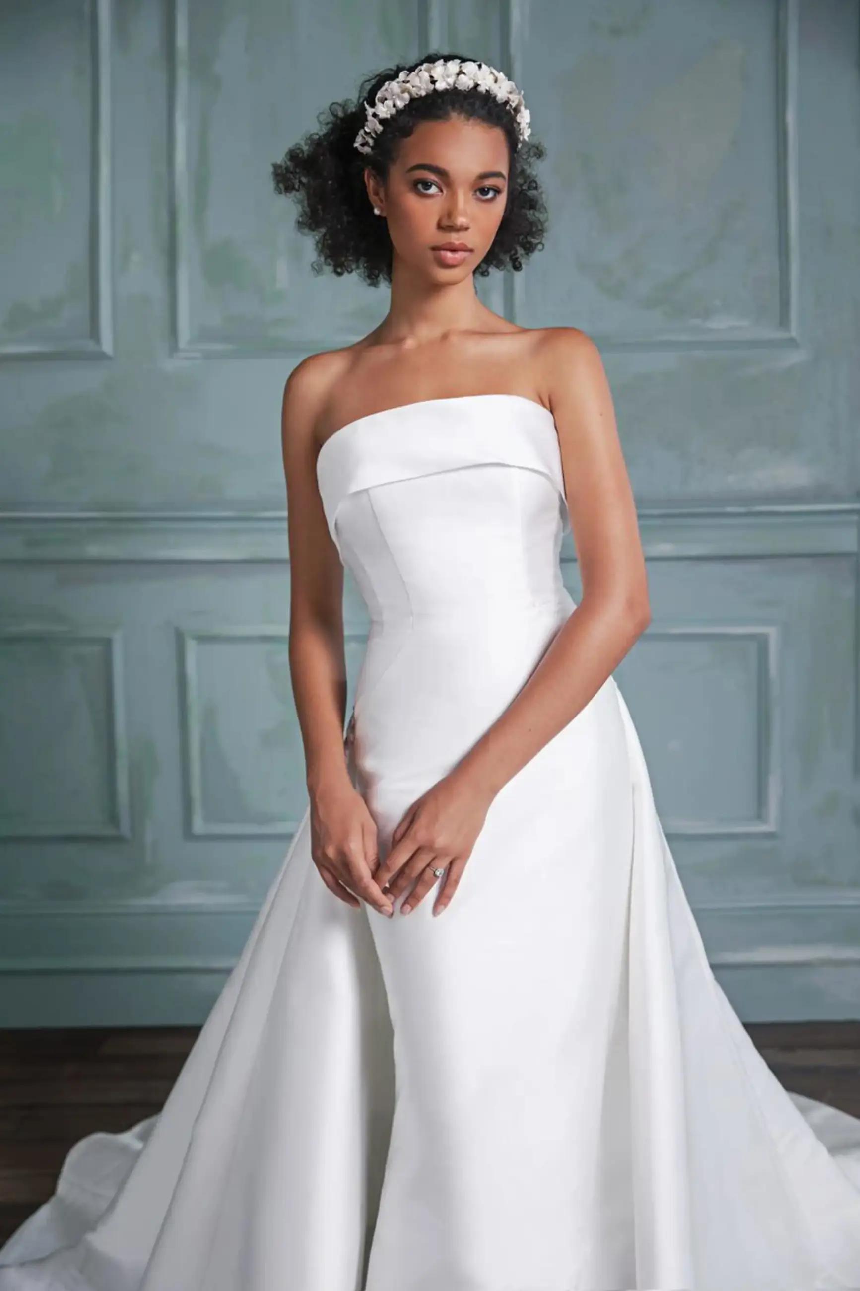 Model wearing a white Anne Barge Gown