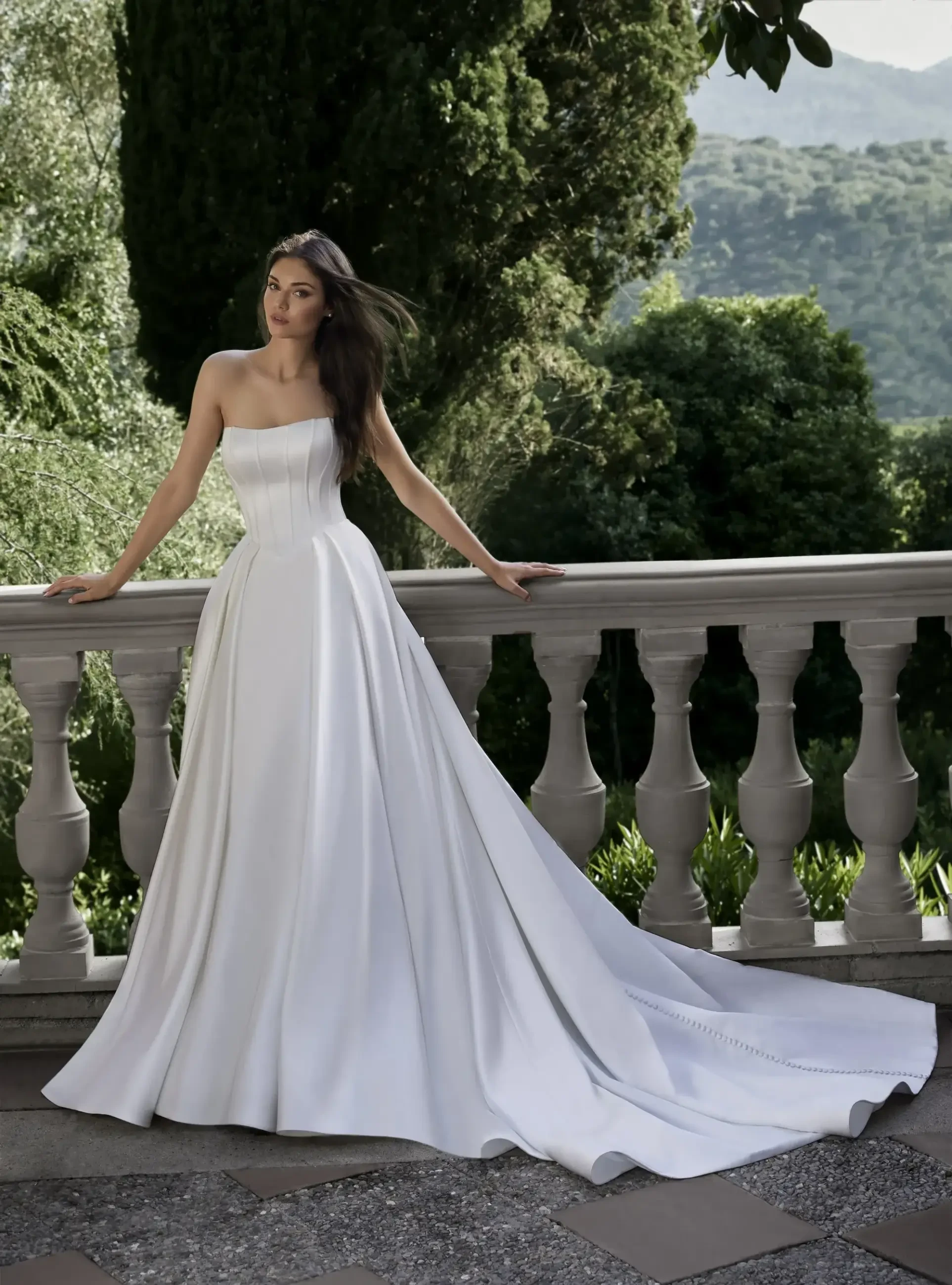 model is wearing a strapless a-line bridal gown