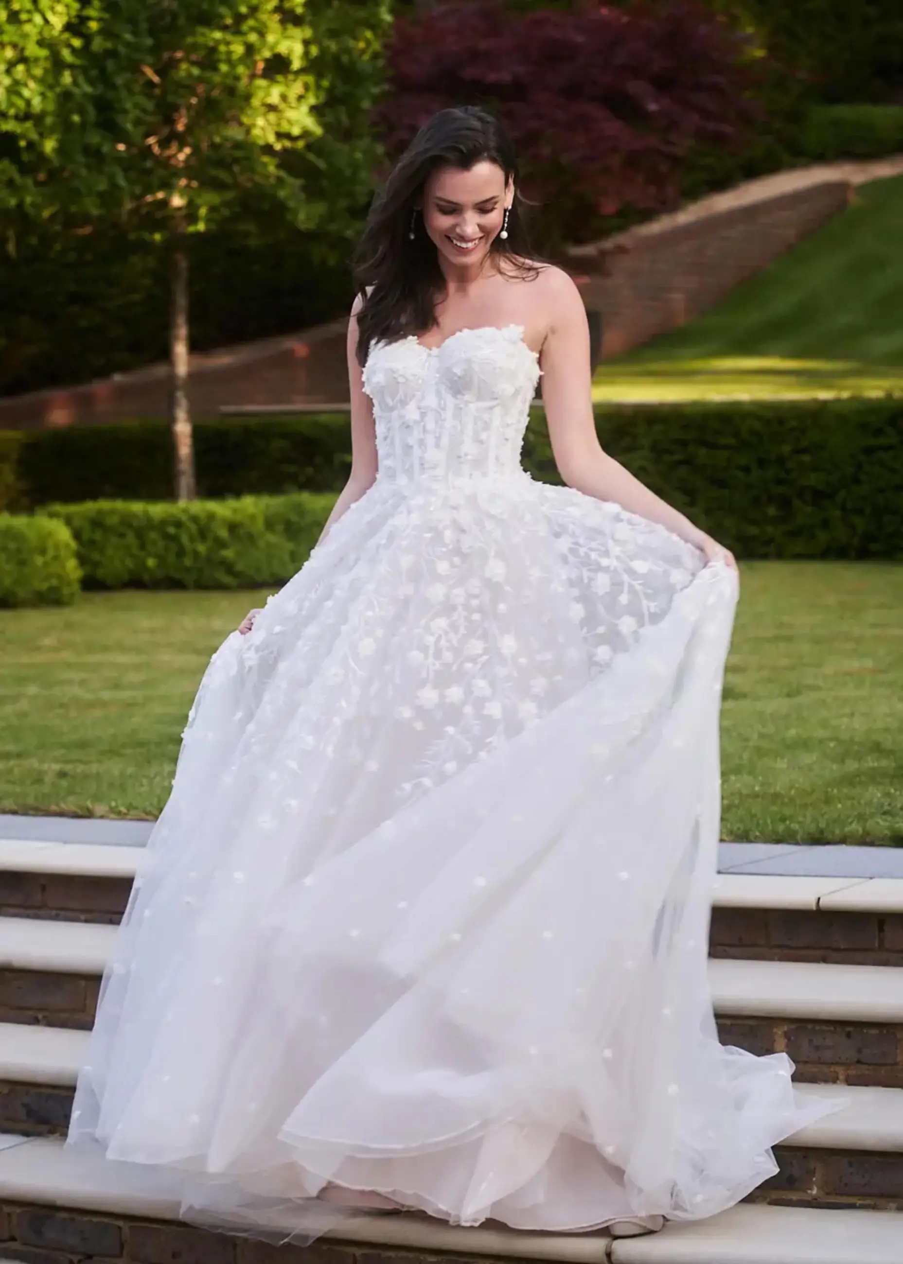 Model wearing a white Anne Barge Gown