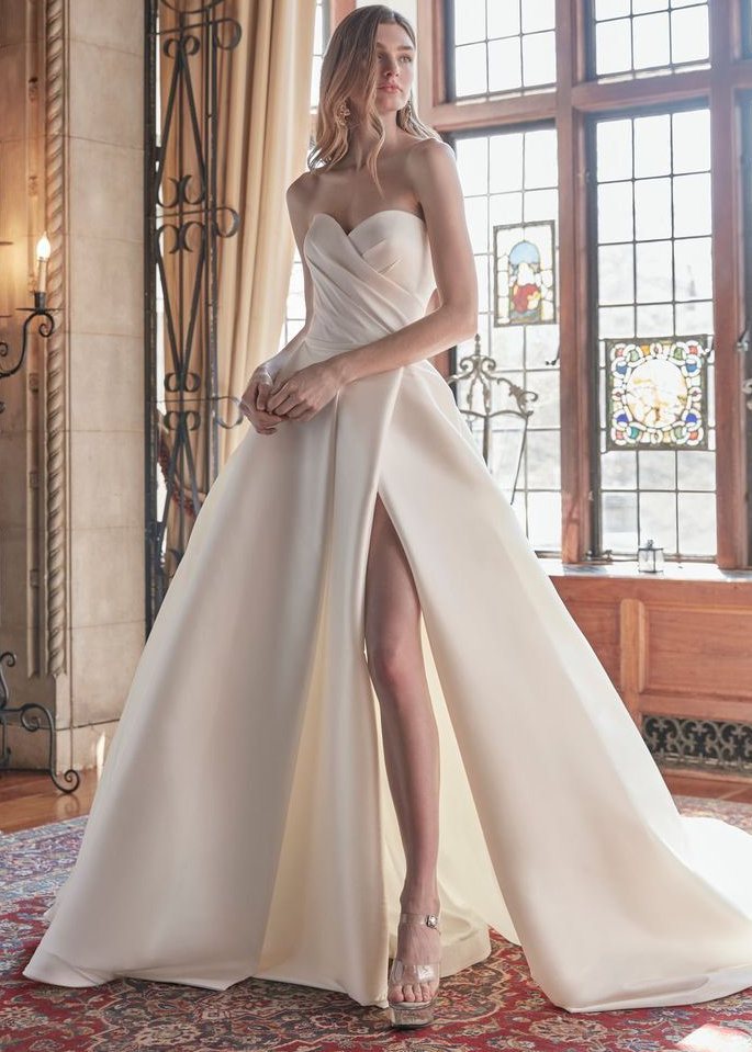 Model wearing a white Anne Barge Gown
