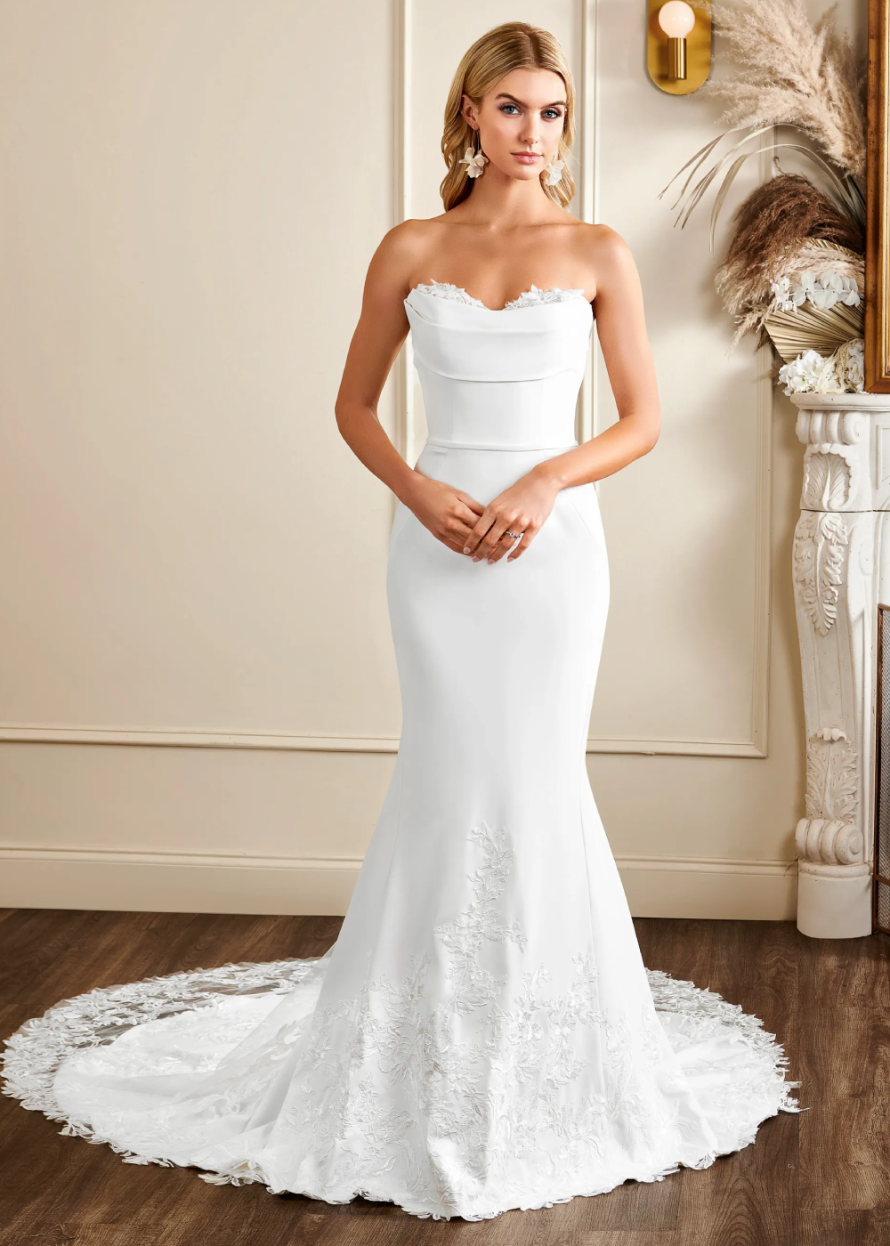 Model wearing a white Kelly Faetanini Gown
