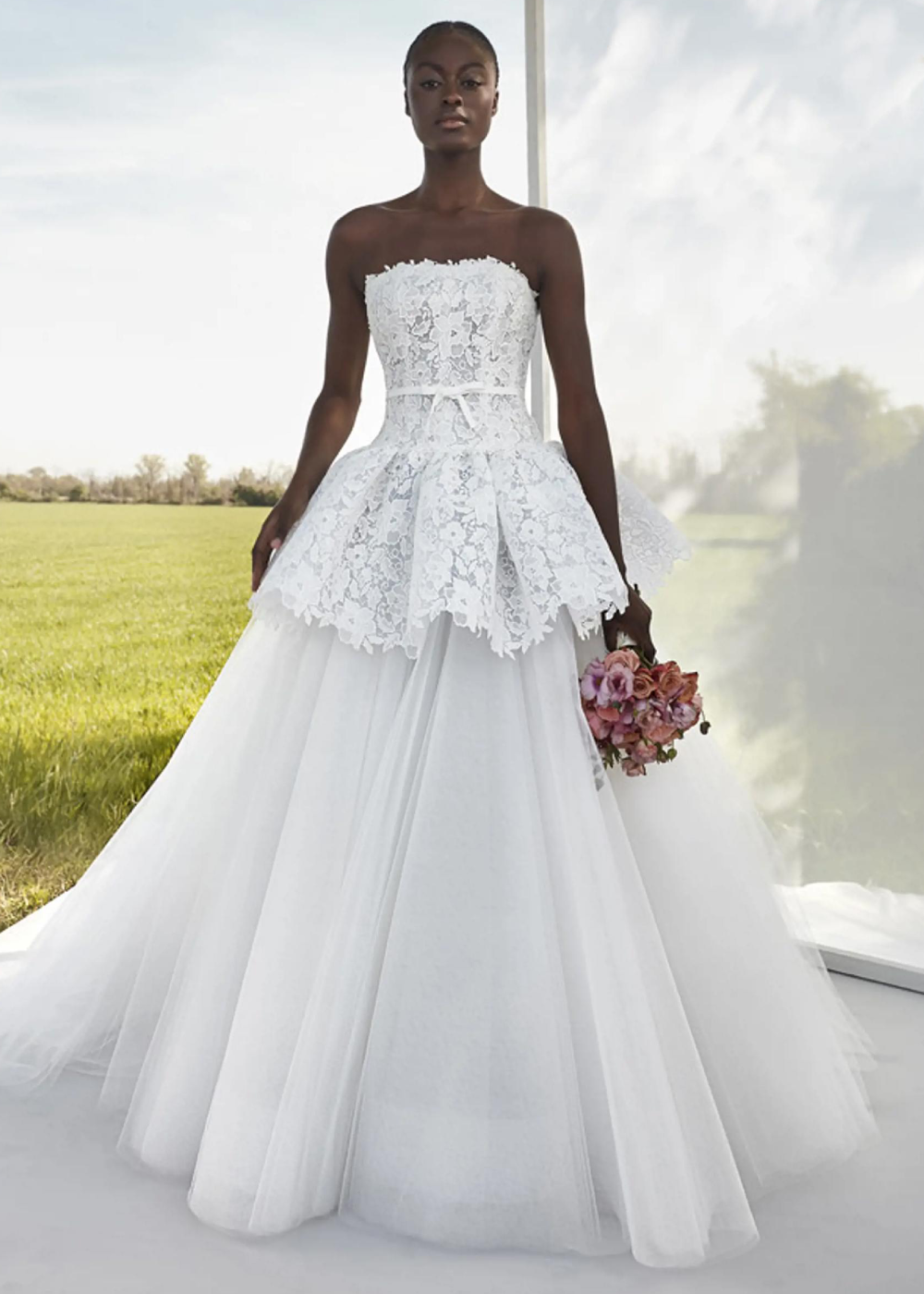 Model wearing a white a JESÚS PEIRÓ Gown