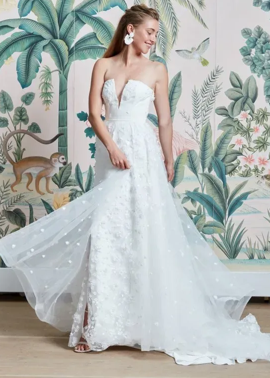 Model wearing a white Anne Barge Gown
