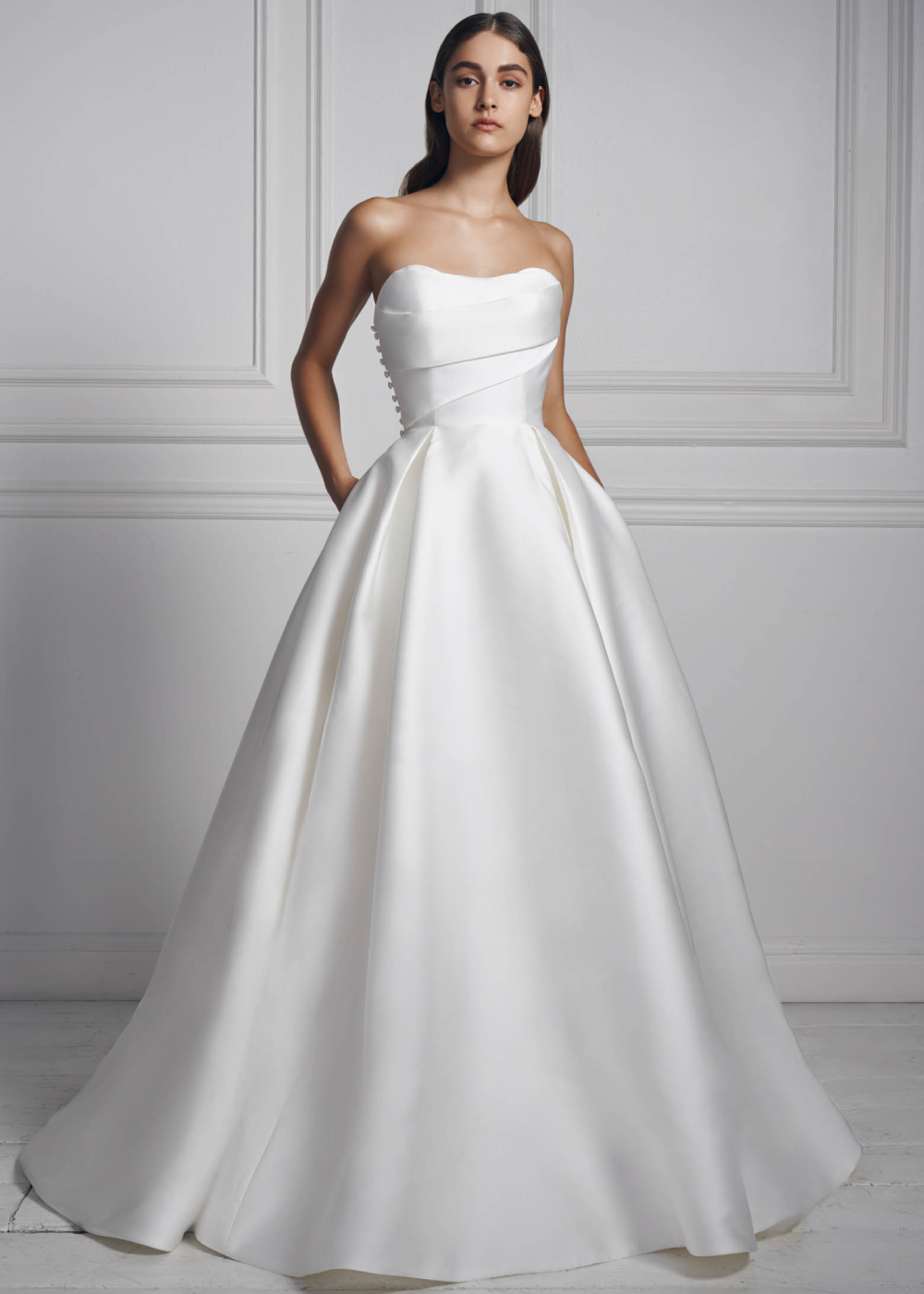 Model wearing a white Anne Barge Gown