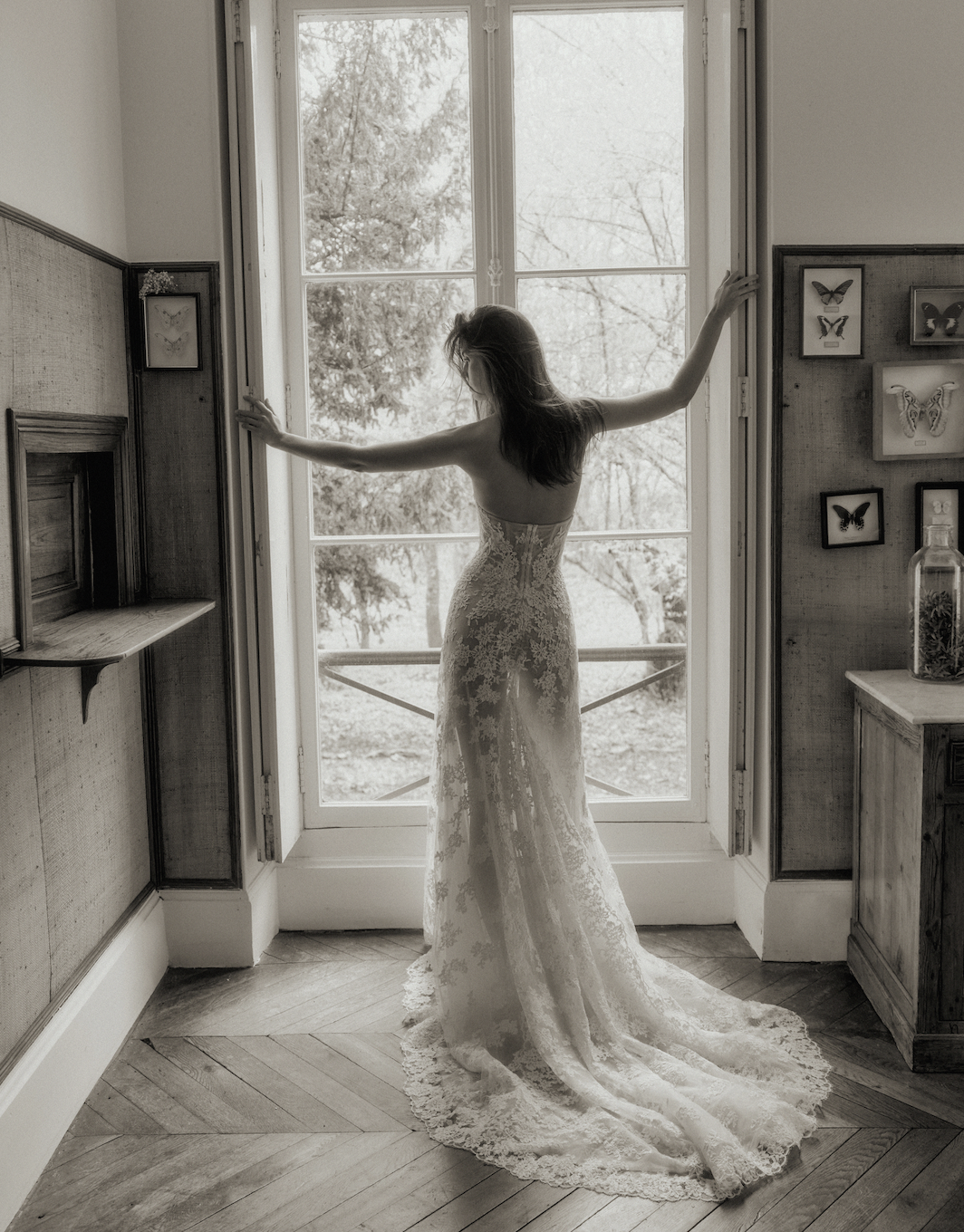 model is wearing a lace dana harel bridal gown