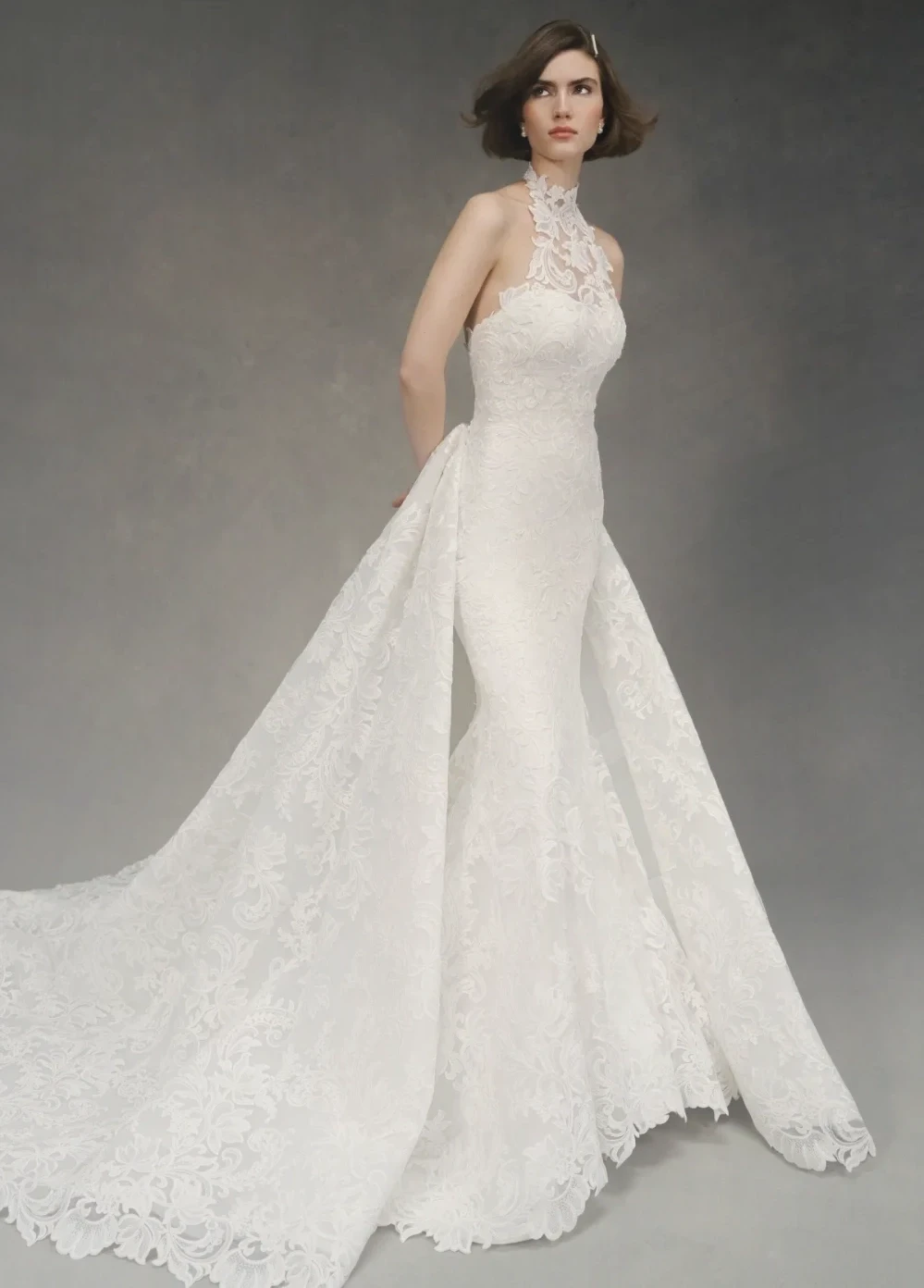 Model wearing a white Anne Barge Gown