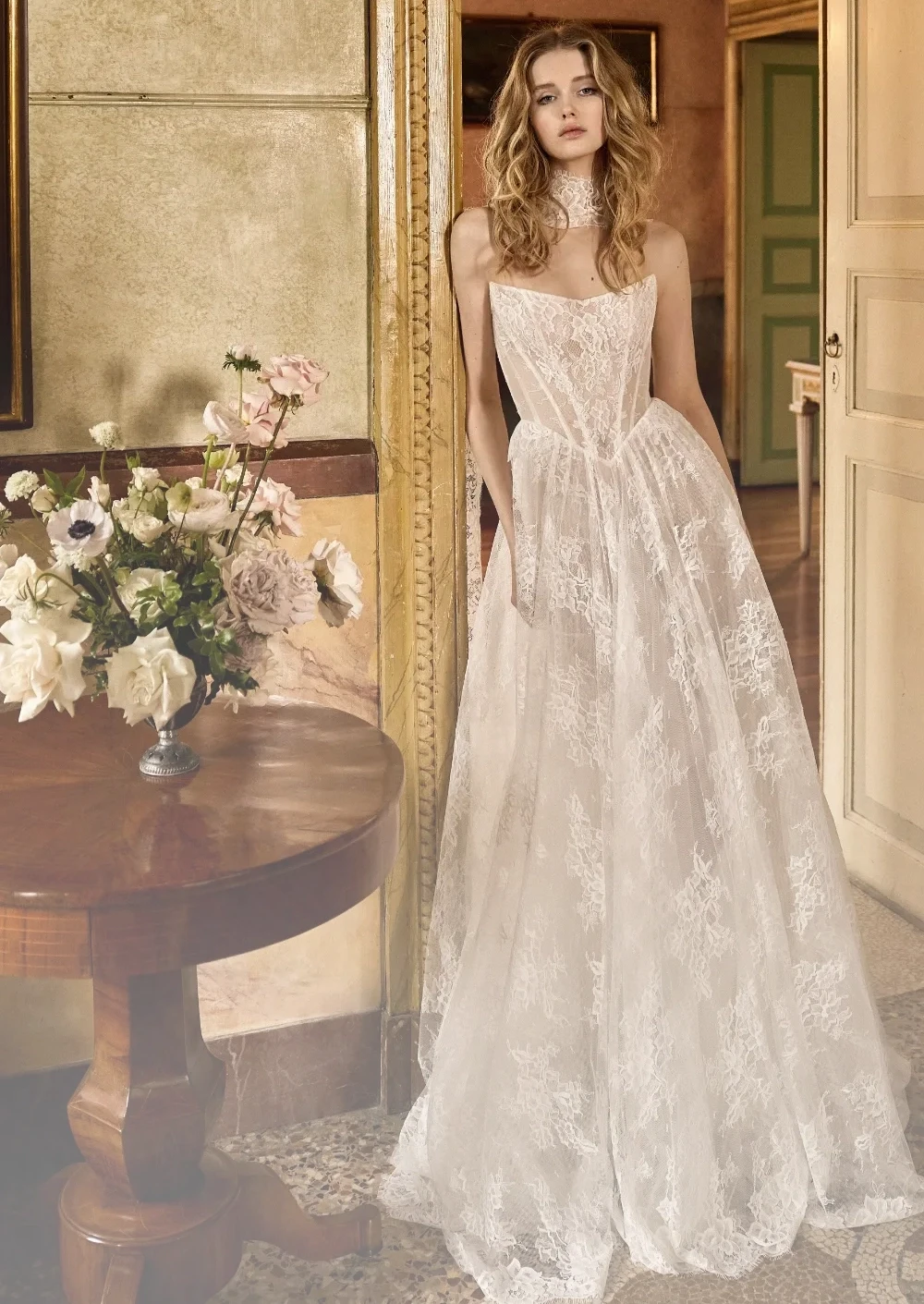 Model wearing a white Flora Gown