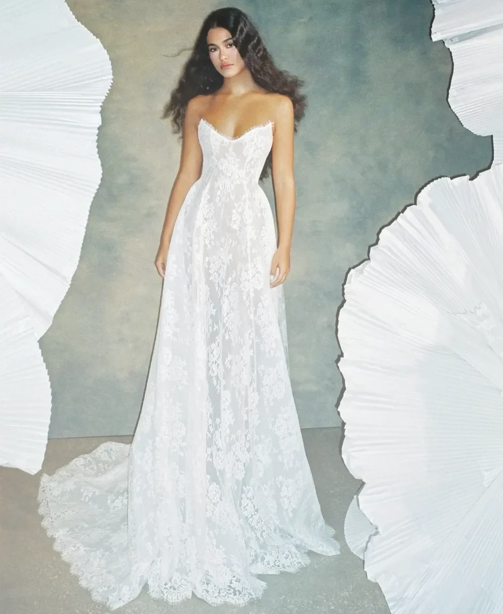 Model wearing a white a Margot Gown