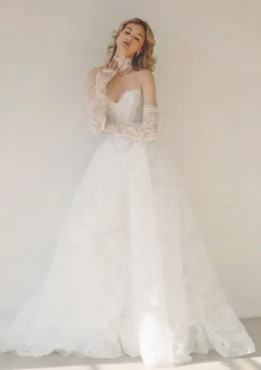 Model wearing a white a Savin London Gown