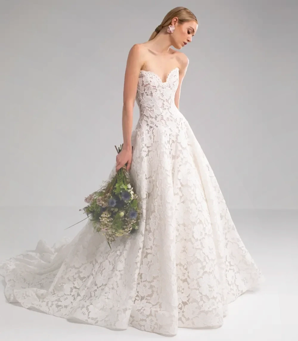 Model wearing a white Valentini Spose Gown