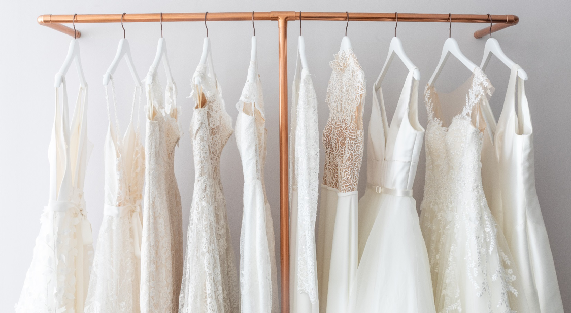 wedding gowns on a rack - mobile